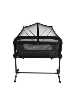 a black baby crib with mosquito netting on it's top and bottom half