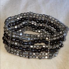 Black & Silver Beaded Stretchy Bracelet. Brand New Condition. Never Been Worn. Silver Stretch Bracelet With Black Beads, Adjustable Black Stretch Bracelet With Silver Beads, Adjustable Silver Bracelet With Black Beads, Black Metal Bracelet With Silver Beads, Black Beaded Bracelets With Silver Beads For Party, Silver Beaded Bracelets With Black Round Beads, Silver Hematite Beaded Bracelets With Black Beads, Party Metal Beaded Bracelets With Black Beads, Silver Beaded Multi-strand Wrap Bracelet