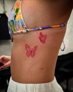 red Butterfly Tattoo Red Butterfly Tattoo Ribs, Red And Black Fine Line Tattoo, Red Rib Tattoo, Fine Line Red Tattoo, Red Sternum Tattoo, Holiday Tattoo Ideas, Red Ink Butterfly Tattoo, Red Fine Line Tattoo