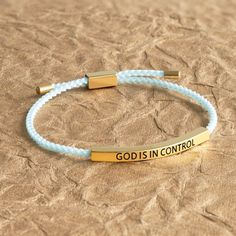 Inspirational bracelet to wear as a reminder you are in God's hands.Made of teal nylon cord with gold-tone accentsGold bar with engraved message, God is in controlAdjustable pull cord with gold cap endsFits most adult wristsChristian fashion accessoryChristianbook Exclusive Gift Design Nativity Star, God Is In Control, Baby Aunt, Christmas Magnet, Gold Cap, Cross Gift, Baby Dedication, Inspirational Bracelets, Gold Caps