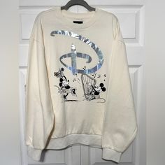 Mickey Mouse &Minnie Mouse Pullover M Sweatshirt For Women By Vans Disney100. New Excellent Condition Size Medium Off White Mickey Strums A Harp For A Dancing Minnie In Vintage Comic Styled Art On This Pullover Sweatshirt By Vans. A Stylish Salute To The Disney100 Celebration, It Has A Shimmering Iridescent Metallic Disney Script ''D'' And The Ribbed Trim Features A Cool Vans ''Checkered'' Print. 60%Cotton/40% Polyester White Disney Sweatshirt For Fall, White Mickey Mouse Sweatshirt For Winter, White Cotton Mickey Mouse Sweatshirt, White Mickey Mouse Winter Sweatshirt, White Letter Print Sweatshirt For Disney Fan Events, Winter White Mickey Mouse Sweatshirt, White Letter Print Sweatshirt For Disney Events, White Graphic Print Sweatshirt For Disney Fan Events, Casual White Mickey Mouse Sweatshirt