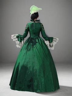 Unveil regal elegance in our Emerald Green Rococo Medieval Dress, a masterpiece crafted for the grandest occasions. This stunning gown merges the timeless allure of Victorian fashion with the opulence of Rococo aesthetics. The rich emerald fabric provides a lush backdrop for the intricate silver lace detailing that cascades through the tiers and adorns the bodice. Perfect for historical reenactments, themed weddings, or any event where making a majestic impression is a must. Each dress comes with a complementary headpiece, ensuring a polished ensemble. As an exclusive treat, each purchase of this majestic attire includes a complementary matching hat, ensuring your ensemble is as regal as a queen's. Gunne Sax Wedding Dress, Victorian Style Wedding Dress, Emerald Fabric, Antique Wedding Dresses, Victorian Style Wedding, Historical Gowns, Nontraditional Wedding Dress, Victorian Gown, Antoinette Dress