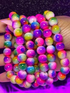 Royal Arm Candy Individual Bracelets feature 8mm or 10mm beads, making it the ideal accessory to adorn your arm and amplify its allure. What do you get: 1 bracelet Fits a 7" wrist but can stretch bigger 10mm beads Cheap Novelty Bracelets With Colorful Beads, Cheap Colorful Beads Stretch Bracelet For Festival, Cheap Handmade Neon Beaded Bracelets, Cheap Rainbow Beaded Bracelets For Festivals, Cheap Rainbow Stretch Bracelet With Colorful Beads, Cheap Novelty Rainbow Beaded Bracelets, Neon Round Bead Bracelets For Gifts, Neon Bracelets With Round Beads For Gift, Neon Beaded Bracelets Gift