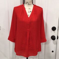 New With Tags. A Flowy And Relaxed Fit Top With Versatile Easy-To-Wear Fabric For The Office And Beyond. V-Neck; Decorative Gold Front Button. 3/4 Sleeves Length With Button Cuffs. Has Flap Detail With Buttons And Sheared Finish At Shoulder. All Polyester And In Red Color. Approximate Flat Measurements: * Armpit To Armpit 18” * Sleeves Length From Shoulder 17” * Body Length From Shoulder 26” Front; 27” Back Thank You For Visiting. Reasonable Offers Are Gladly Accepted. Army Green Blouse, White Polka Dot Top, Lace Trim Blouse, Feminine Top, Black Peplum, Sleeves Blouse, Leopard Print Blouse, Polka Dot Blouse, Green Blouse