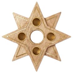 a wooden star with three holes in the middle and gold trimmings on it