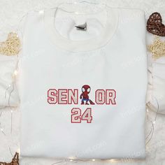 Senior Spider Man Embroidered T-shirt, Marvel Movie Embroidered T-shirt, Best Gift Ideas White Embroidered T-shirt For College, Cotton T-shirt With Letter Embroidery For College, White Embroidered Graphics T-shirt For College, College Red Tops With Embroidered Text, Red College Tops With Embroidered Text, Red College Top With Embroidered Text, Red Embroidered Text College Tops, School Spirit T-shirt With Embroidered Graphics For College, College T-shirt With Embroidered Graphics For School Spirit