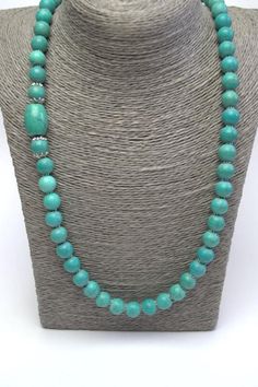 Long Turquoise Necklace Beautiful light blue turquoise gemstones in a larger size give this lovely necklace its distinctive look. Pretty antiqued silver beads adorn the ends of the necklace while an silver toggle clasp completes the design. This necklace's simple design and beautiful turquoise color make it easy to wear both day and night and will always look pretty on you! Turquoise is a calming and relaxing stone, good for meditation. It supports creativity and imagination, brings positive cha Personalized Gifts Christmas, Long Turquoise Necklace, Opal Wedding Rings, Agate Jewelry, Necklace Statement, Necklace Long, Lovely Necklace, Genuine Turquoise, Pretty Gift