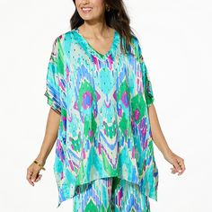 IMAN Global Chic Printed Woven Scarf Top Curate a timeless wardrobe with a little help from Iman. This gorgeous loose-fitting top features a printed on the oversized, drapey silhouette, creating a fashionable masterpiece any time you wear it. Flowy Short Sleeve Tops For Loungewear, Green Printed Top For Loungewear, Oversized Patterned Summer Tops, Oversized Patterned Top For Summer, Spring Vacation Top With Batwing Sleeves, Patterned Printed Top For Loungewear, Green Batwing Sleeve Tops For Summer, Oversized Patterned Tops For Spring, Casual Printed Tunic Top