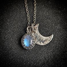 Enchanting, iridescent moonstone is set in a 925 sterling silver, handcrafted filigree crown bezel and accompanied by a hammered floral crescent moon. Suspends from a lightweight antique etched cable chain with an artisan hook & loop closure.  ~Please let me a note if upon purchase if you prefer a spring lobster clasp vs hook. ~Wrapped in black gift box ~Handmade in Tennessee Silver Celestial Oval Jewelry, Celestial Silver Labradorite Jewelry, Mystical Oval Moon Phase Jewelry, Silver Labradorite Moon-shaped Jewelry, Bohemian Moon Shaped Jewelry With Oxidized Finish, Sterling Silver Moon-shaped Wedding Jewelry, Sterling Silver Moon Jewelry For Wedding, Bohemian Moon-shaped Jewelry With Oxidized Finish, Bohemian Moon-shaped Oxidized Jewelry