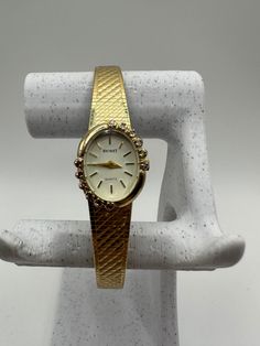 Behold the rare and exquisite Nicolet vintage ladies diamond Quartz watch in a captivating gold tone - an exceptional gift for her. This fashion designer timepiece features a tastefully adjustable strap, ensuring a perfect fit for any wrist. In good shape and adorned with diamonds, it radiates timeless allure. Fitted with a new battery, this watch seamlessly combines style and functionality, making it an extraordinary accessory for women with a discerning taste for unique and elegant pieces. Comes with a Swiss eta movement  Please message me with any questions Gold Diamond Jewelry And Watches For Evening, Antique Yellow Gold Diamond Watch For Formal Occasions, Elegant Yellow Gold Jewelry For Evening, Elegant Formal Jewelry And Watches With Clasp, Evening Diamond Watch With Yellow Gold Accents, Gold Diamond Watch For Evening, Vintage Yellow Gold Jewelry And Watches For Evening, Vintage Yellow Gold Diamond Watch, Antique Gold Watches With Diamond Hour Markers