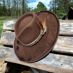 High quality and one-of-a-kind design.  Rolled stiff brim hat with feathers and mountains. Hand Burned. Size large. Adjustable to fit from 56 to 59cm This is an American Hat Makers hat. no longer under AHM guarantee once embellished. Hat Maker, American Hat Makers, American Hat, Hand Burn, Chapeau Cowboy, Cow Boy, Brim Hat, Cowboy Hats, Caps Hats