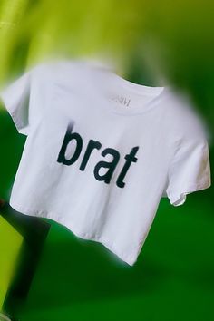 Bumpin' that in this Charli XCX Brat graphic baby tee. Designed in a slim & cropped fit so when you’re looking in the mirror you like what you see. Only at Urban Outfitters. Features Charli XCX Brat graphic baby tee Fitted graphic tee Soft and stretchy knit Crew neckline with short sleeves Brat graphic across the chest Slim fit Cropped length Easy pull-over style UO exclusive Content + Care 100% Cotton Machine wash Imported Size + Fit Model in Green is 5'9" and wearing size Small Measurements taken from size Small Chest: 32" Length: 16.5" | Charli XCX UO Exclusive Brat Graphic Baby Tee in White, Women's at Urban Outfitters Cropped Cotton T-shirt With Text Print, Fitted Cropped T-shirt For Streetwear, Fitted Cropped T-shirt With Letter Print, Fitted Cotton Cropped T-shirt With Graphic Print, Fitted Logo Print Crop Top For Summer, Summer Casual Cropped Shirt With Logo Print, Casual Cropped Shirt With Logo Print For Summer, Graphic Cropped T-shirt For Streetwear With Stretch, Graphic Tee Cropped T-shirt For Streetwear