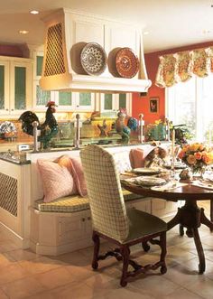 a kitchen filled with lots of furniture and decor