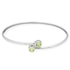 This beautiful bangle bracelet is crafted in 925 sterling silver and complemented with round cut bezel set CZ totaling 0.80Ct. The high polish finish gives it additional shine. Available in different colors. Size: one size.  Gender: female.  Age Group: adult. Bohemian Sterling Silver Bangle With Gemstone, Adjustable Sterling Silver Gemstone Bangle, Silver Labradorite Bangle Bracelet, Green Sterling Silver Bangle, Perfect As A Gift, Spiritual Nickel-free Sterling Silver Bangle, Bezel Setting, Womens Bracelets, Womens Watches, Different Colors