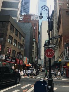 a busy city street filled with lots of tall buildings