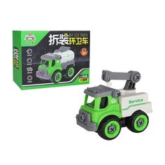 a green and white toy truck next to a box