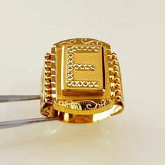 a gold ring sitting on top of a table