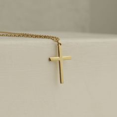 Showcase your faith with our Cross Pendant Necklace. The perfect gift for confirmation, christening, or any special occasion. Made for women who want to make a statement of their belief in a stylish and elegant way. Get one for yourself or a loved one today! Pendant width: 10 Millimeters; Pendant height: 16 Millimeters Please note that we also offer matching Cross Bracelet in our shop! Classic Crucifix Jewelry For First Communion, Classic Cross Pendant Jewelry For First Communion, Classic 14k Gold Cross Necklace For Gift, Elegant Cross Charms For First Communion, Elegant Cross Jewelry And Charms For First Communion, Classic 14k Gold Cross Necklace As Gift, Elegant Cross Jewelry For First Communion, Elegant Crucifix Cross Necklace For First Communion, Elegant Cross-shaped Jewelry For First Communion