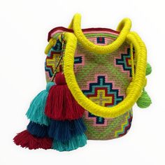 "Stunning shoulder bag crafted by native indigenous from Colombia.  This colorful crocheted  bag with its complex patterns revive the culture, beliefs, and life of Wayuu people. Handmade bag with shoulder strap, super practical for anytime anywhere. Its colors and precious patterns go with any outfit, from casual to formal, in any season. This bag is an authentic artisan handcrafted work.        Description: Brand: Neryco Material Cotton thread  and acrylic. Width  12\"  Height: 11\" Strap drop: 10\" Delivery: In Stock immediately  Care Instructions To Clean Your Wayuu Bags. Learn More!" Traditional Multicolor Bucket Bag With Adjustable Strap, Artisan Multicolor Bucket Bag With Adjustable Strap, Artisan Multicolor Shoulder Bag With Adjustable Strap, Multicolor Woven Bucket Bag For Travel, Multicolor Weaving Bucket Bag For Travel, Artisan Multicolor Crochet Bag With Adjustable Strap, Traditional Multicolor Crochet Bag With Adjustable Strap, Colorful Handwoven Shoulder Bag For Travel, Multicolor Woven Crossbody Bucket Bag