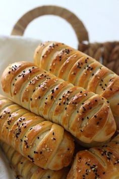 several loaves of bread with sesame seeds on them