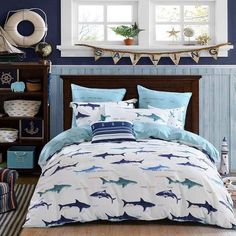 a bed room with a neatly made bed next to a book shelf and window sill