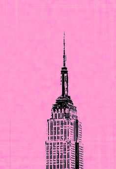 the empire building in new york city against a pink sky