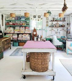 a room filled with lots of furniture and baskets on top of it's shelves