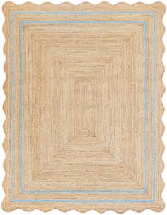 an area rug with scalloped edges in beige and blue