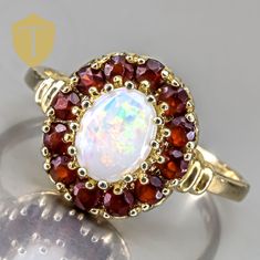 This vintage 14K gold ring showcases a stunning opal that radiates vibrant hues, making it a true statement piece. Weighing 3.2g and sized at 8.5, it features an approximate finger coverage of 13.5mm and a rise of 5.5mm, creating an elegant silhouette on the hand. Marked with "14k" and in great condition, this ring beautifully blends classic charm with the captivating allure of opal, perfect for those who appreciate unique and timeless jewelry. Karat: 14K Weight: 3.2 g Size: 8.5 Approximate measurement: coverage: 13.5 / Rise: 5.5 Stone(Approx. Size):  Opal Markings: 14k  Condition: Great Approx Era: Vintage DELIVERY Our shipping and handling is always fast & free unless otherwise stated. Once an order is placed and payment is received, all items are shipped within one business day, excludi Ladies Ring, Timeless Jewelry, 14k Gold Ring, Vintage Ring, Future Husband, Rings Statement, Gold Ring, Women Rings, Statement Rings