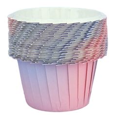 a pink and silver cup sitting on top of a white table