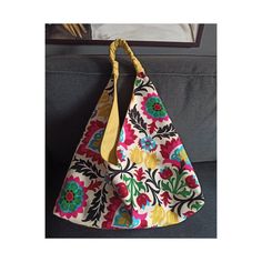 This hobo boho bag is made of ethnic tulip design printed fabric and yellow canvas linen fabric.  This origami hobo bag can be reversed so you can turn it inside out and use it two ways.  Normally this is a shoulder bag and has a handle made of its own yellow fabric and length is 25 cm, 9,84".  It is possible to make the handle longer enough to use this origami bag as a crossbody sling bag.  If you would like to use it as a crossbody bag, just please kindly convo me, how tall are you and which c Bohemian Multicolor Reversible Bag, Bohemian Reversible Shoulder Bag, Bohemian Multicolor Canvas Bag For Everyday, Multicolor Bohemian Canvas Bag For Everyday, Bohemian Multicolor Canvas Bag For Everyday Use, Bohemian Reversible Hobo Bag For Daily Use, Bohemian Reversible Hobo Tote Bag, Bohemian Reversible Hobo Bag For Travel, Bohemian Reversible Hobo Bag For Everyday Use