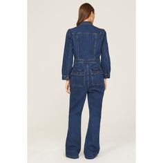 Blue denim (99% Cotton, 1% Elastane). Jumpsuit. Long sleeves. Collar. Front button closure. 32" inseam. 12" rise. Imported. Fitted Cotton Utility Denim Jumpsuit, Fitted Cotton Denim Utility Jumpsuit, Fitted Medium Wash Denim Jumpsuit For Work, Fitted Medium Wash Utility Jeans, Fitted Utility Jeans In Medium Wash, Fitted Cotton Denim Jumpsuit With Button Closure, Fitted Straight Leg Denim Jumpsuit For Work, Fall Workwear Denim Button-up Jumpsuit, Spring Workwear Denim Jumpsuit With Button Closure