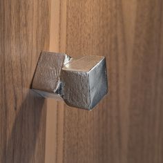 a wooden door with a metal handle on it