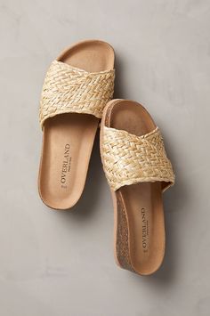 Fresh as an evening in June, with summery hues to match, the Emilia slide sandals will accompany you with style to every outdoor gathering of the season. They're crafted from woven Italian raffia fiber, with a crossover strap that's lined in smooth pigskin leather for comfortable wear. Cork/latex-blend midsoles with a slight wedge heel and cushioned orthotic footbeds covered in suede offer support and comfort. Finished with a molded EVA outsole. Summer Slides 2023, Summer Sandals 2024, Cute Slides For Women, Comfortable Sandals For Women, Womens Comfortable Sandals, Sandals Ideas, Italian Leather Sandals, Arch Support Sandals, Classic Sandals