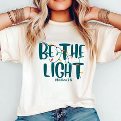 Be the Light | Christian Christmas Shirts | Christian T-Shirts | Bella Canvas T-Shirts | Christmas Bella Canvas | Be the Light Shirt * 100% combed and ring-spun cotton (Heather colors contain polyester) * Fabric weight: 4.2 oz./yd.² (142 g/m²) * Pre-shrunk fabric * Side-seamed construction * Shoulder-to-shoulder taping * Blank product sourced from Nicaragua, Mexico, Honduras, or the US This product is made especially for you as soon as you place an order, which is why it takes us a bit longer to Christian Christmas Shirts, Be The Light Shirt, Christian T Shirts, Be The Light, Christian Christmas, Christmas Deals, Christian Shirts, Nicaragua, Honduras