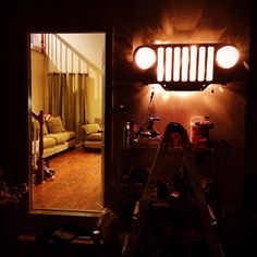 a room with a ladder in it and lights on