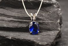 Blue Sapphire Necklace set with a Created Sapphire in a perfect diamond cut, flawless clarity & Royal Blue color, at 10x8mm, 3 Carats. Royal Blue Pendant design made of Gold Vermeil ☞ thickest 18k Gold Plating on top of Solid 925 Sterling Silver ☞ made to last. Free Gold Vermeil Chain with every Pendant order, 18 inch Silver chain (46 cm) ✓ Matching Ring & Matching Earrings - please ask me ⌛Last Pendant left ⌛ Details : ♥ Each item packaged in a cute GIFT BOX ✓ ♥ GUARANTEE on the materials ✓ ♥ C Oval Blue Diamond Cut Necklace, Blue Oval Diamond Cut Necklace, Blue Oval Pendant Jewelry With Polished Finish, Blue Oval Pendant With Polished Finish, Blue Oval Faceted Necklaces, Blue Oval Faceted Necklace, Blue Oval Pendant Necklace With Diamond Cut, Oval Sapphire Jewelry With Vvs Clarity, Oval Blue Faceted Jewelry