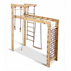 a wooden swing set with ropes and ladders attached to the top, in front of a white background