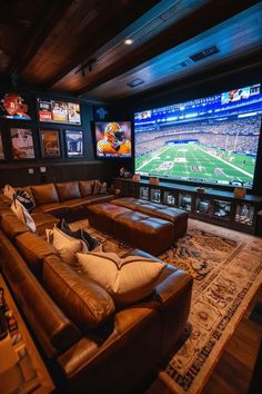 a living room filled with furniture and a large screen tv mounted to the wall above it