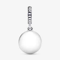 Meet the Mama Engravable Dangle Charm – a sterling silver piece that celebrates motherhood with a hint of humor. This Pandora charm features a round disc engraved with the words "Don't mess with Mama." The charm's unique touch lies in the enamel-filled 'Mama,' adding a pop of black. The bail is adorned with raised hearts and lines. What makes it extra special? The reverse side is ready for your personal touch with a personalised engraving to make it even more unique. Gift it as a special token for your mom for a playful tribute to the joy of motherhood. - Pandora Mama Engravable Dangle Charm - Enamel / Sterling silver / Black Sterling Silver Round Charms For Mother's Day, Engraved Sterling Silver Round Pendant Charms, Everyday Silver Round Charms, White Gold-colored Sterling Silver Round Charms, Engraved White Gold Round Pendant Charms, Silver Round Minimalist Charms, Elegant Silver Moon Charm, Minimalist Silver Round Pendant Charms, Custom Charm Bracelet