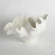 a white ceramic bowl sitting on top of a table