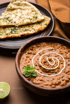 a bowl of soup with tortilla bread on the side - stock photo - images