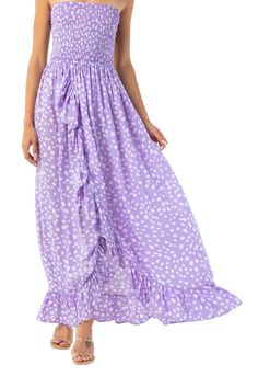 We're in love with this strapless purple polka dot printed maxi which we can't wait to wear all summer long -- from the beach to dinner. The dress features a strapless smocked top with a flowy, ruffled bottom and the chicest, open back. 100% Rayon Hand Wash Cold Chic Flowy Strapless Beach Dress, Bandeau Strapless Dress With Ruffles For Beach, Bohemian Strapless Mini Dress For Beach, Chic Flowy Strapless Dress For The Beach, Flowy Strapless Dress For Beach, Strapless Maxi Dress For Beach In Summer, Summer Strapless Dress With Ruffles For Beach, Flowy Bohemian Strapless Dress For The Beach, Flowy Strapless Sundress For The Beach