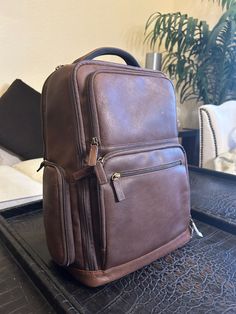 The organized tech backpack is perfect for travel or daily commuting. It features a padded pocket for up to a 15" laptop, a tablet, and all your business essentials such as files, notebooks, wallet and more. Top grab handle and the adjustable back straps make this the most comfortable and easy backpack to wear and use. Tech Storage, Full Grain Leather Bag, Wallet Storage, Leather Backpack For Men, Tech Backpack, Business Essentials, Leather Duffle Bag, Leather Laptop Bag, Leather Duffle