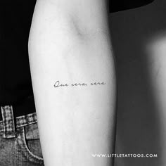 a woman's arm with the words one song, and an arrow on it