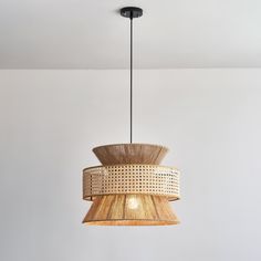 a wooden light fixture hanging from the ceiling