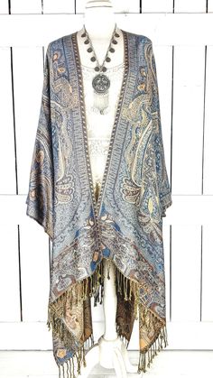 "Handmade blue and tan tribal paisley pashmina kimono cover up jacket with custom regular and maxi lengths and optional fringe detail Measurements...taken flat - width across seam to seam: 46\" - regular length with fringe: 38\" - regular length without fringe: 34\" - Maxi length is as selected with or without fringe Features... - lovely soft woven medium weigh pashmina fabric - bohemian oversized flowing design - cardigan style with an open front and generous arm holes - universal design allows Bohemian Long Sleeve Kimono With Fringe, Fall Beach Kimono With Tassels, Fringe Kimono For Beach In Fall, Long Sleeve Festival Kimono With Fringe, Long Sleeve Fringe Kimono For Festivals, Festival Long Sleeve Kimono With Fringe, Oversized Bohemian Outerwear With Fringe, Bohemian Fringe Kimono One Size, One Size Bohemian Kimono With Fringe