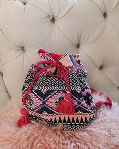 Gorgeous beaded tapestry details adorn this backpack. Designed with a tassel top cinch closure, adjustable backpack straps, a fully lined interior, and three inner pockets for storage. Not to small, but not to big... perfect for everyday use. Width: 14" Height: 12" Cheap Bohemian Multicolor Backpack, Pink Backpack For Vacation, Bohemian Pink Bucket Bag For Travel, Pink Bohemian Bucket Bag For Travel, Pink Bohemian Bucket Bag, Bohemian Woven Backpack For Daily Use, Bohemian Bucket Bag Backpack For Daily Use, Bohemian Backpack With Adjustable Strap For Travel, Bohemian Backpack Bag With Adjustable Strap