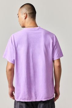 Ribbon-topped graphic tee with a kitsch print on the front. Soft jersey tee with a crew neck, drop shoulders and short sleeves. Content + Care 100% Cotton Machine wash Imported Size + Fit Model is 185cm/6'1" and wearing size Medium Use our size guide to check how this product fits | Urban Outfitters UO Lilac IDGAS Tee in Pink, Men's at Urban Outfitters Urban Purple Cotton T-shirt, Urban Style Purple Cotton T-shirt, Urban Outfitters Graphic Tee With Text Print, Oversized Short Sleeve Tops By Urban Outfitters, Urban Outfitters Oversized Short Sleeve Tops, Urban Purple Short Sleeve T-shirt, Urban Outfitters Oversized Casual T-shirt, Casual Oversized T-shirt From Urban Outfitters, Oversized Crew Neck Tops By Urban Outfitters