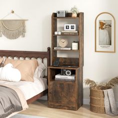 a bed room with a neatly made bed and a wooden book shelf next to it